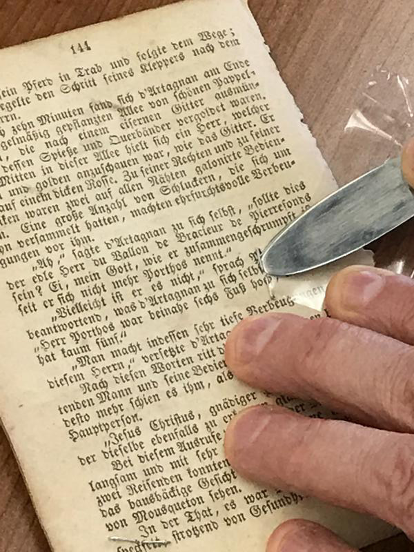 Collections Care workshop image of mending a tear